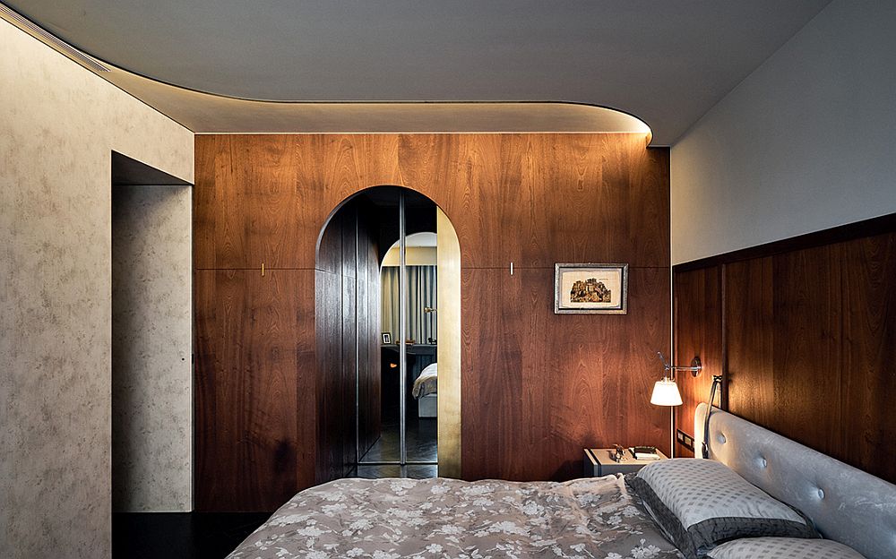 Contemporary bedroom with concrete and wood walls