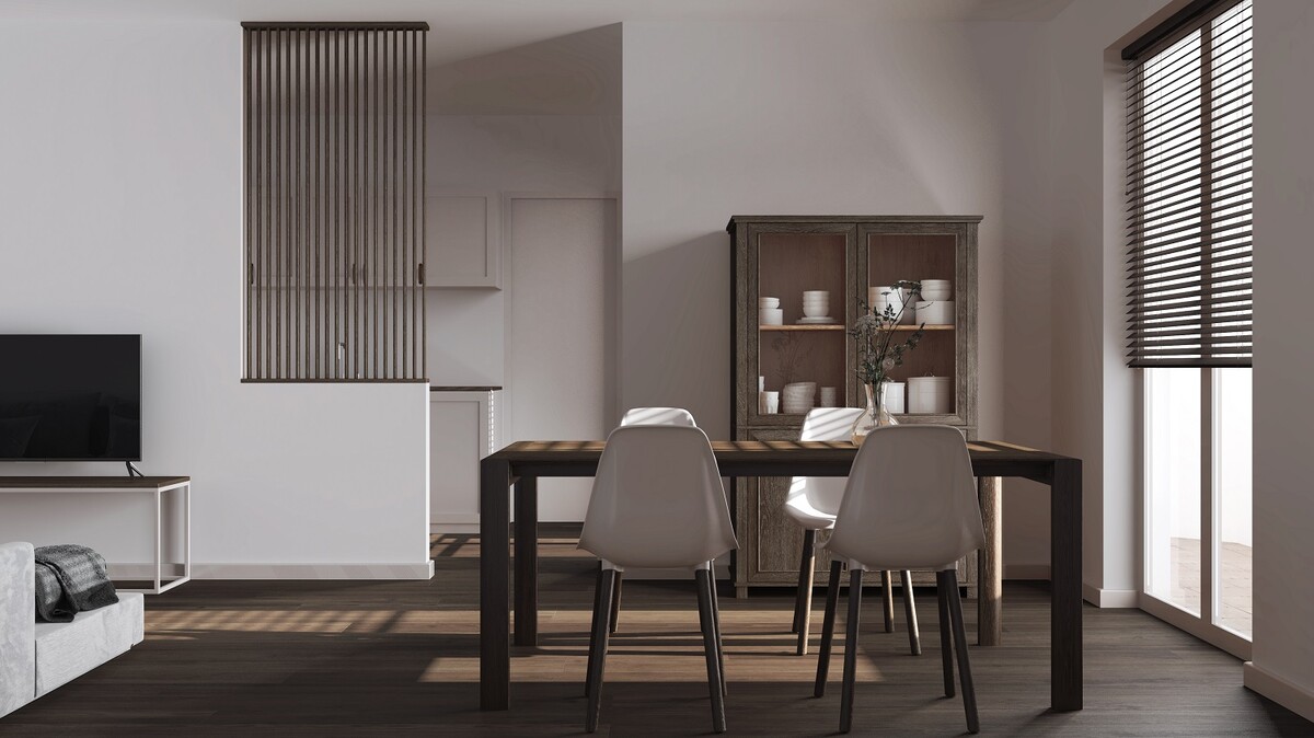Scandinavian dark wooden dining and living room in white tones. Table with chairs, partition wall over modern kitchen. Parquet floor and decors. Minimal interior design